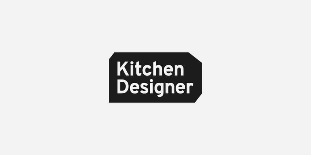 Kitchen Designer in a rectangle with angled corners on thre sides clockwise from top-left. Greyscale.