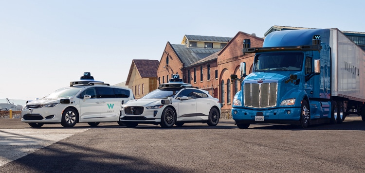Waymo Google Self-driving cars. Two cars and one HGV lorry parked in a line.